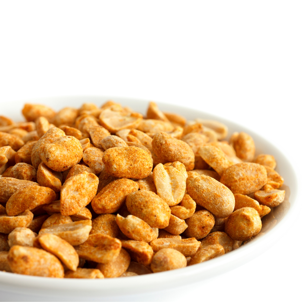 Alune picante, orange-spiced roasted peanuts in a white bowl